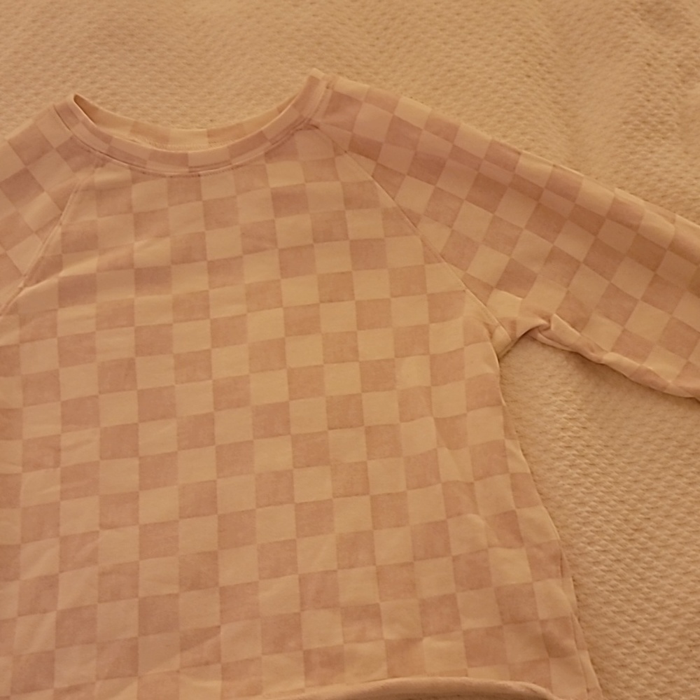 A pink and white checkered carter's size twelve top.